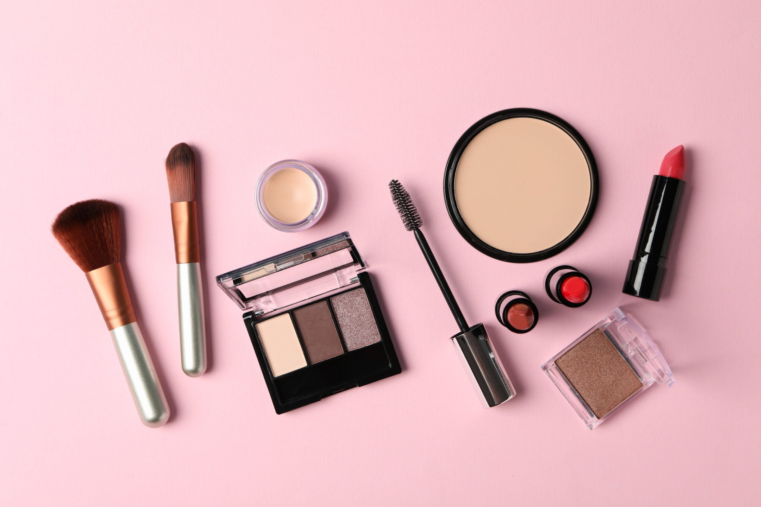 Sản phẩm makeup nào an toàn cho mí sau phun? 2 different makeup cosmetics on pink background fem 2022 02 07 11 21 41 utc scaled 1